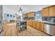 Bright kitchen with oak cabinets, stainless steel appliances, and an island at 8586 Edgewood Dr., Myrtle Beach, SC 29588