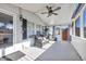 Relaxing screened porch with ceiling fan and comfy seating at 8586 Edgewood Dr., Myrtle Beach, SC 29588