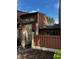 Rear view of brown townhome with wooden fence and gate at 610 14Th Ave. S # 181, Surfside Beach, SC 29575