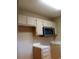 Upper and lower kitchen cabinets with stainless steel microwave at 610 14Th Ave. S # 181, Surfside Beach, SC 29575