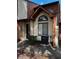 Exterior view of a brown two-story townhome with a small front yard at 610 14Th Ave. S # 181, Surfside Beach, SC 29575