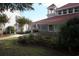 Community clubhouse with landscaping and American flag at 4396 Baldwin Ave. # 12, Little River, SC 29566