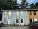 Two-unit building with gray and wood siding at 3456 Macklen Rd. # 18-B, Myrtle Beach, SC 29588