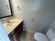 Clean bathroom with single sink vanity, toilet and mirror at 3456 Macklen Rd. # 18-B, Myrtle Beach, SC 29588