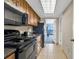 Small kitchen with black appliances and ocean view at 1105 Ocean Blvd. S # 412, Myrtle Beach, SC 29577