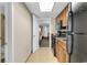 Kitchen with black appliances and wood cabinets at 1105 Ocean Blvd. S # 412, Myrtle Beach, SC 29577