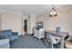 Bright living room with dining area and view into kitchen at 1105 Ocean Blvd. S # 412, Myrtle Beach, SC 29577