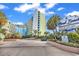 Coral Beach Resort entrance with lush landscaping at 1105 Ocean Blvd. S # 412, Myrtle Beach, SC 29577