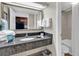 Bathroom with granite countertop, single sink and shower/tub combo at 1105 Ocean Blvd. S # 412, Myrtle Beach, SC 29577
