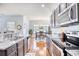 Modern kitchen with granite countertops and stainless steel appliances at 911 Ocean Pines Ct., North Myrtle Beach, SC 29582