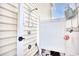 Outdoor shower with privacy screen and storage shelf at 911 Ocean Pines Ct., North Myrtle Beach, SC 29582