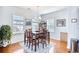 Bright dining room with hardwood floors and a charming chandelier at 911 Ocean Pines Ct., North Myrtle Beach, SC 29582
