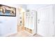 White cubby system with storage baskets in a light hallway at 911 Ocean Pines Ct., North Myrtle Beach, SC 29582