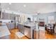 Open kitchen with granite countertops, stainless steel appliances, and breakfast bar at 911 Ocean Pines Ct., North Myrtle Beach, SC 29582