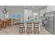 Open concept kitchen with island, stainless steel appliances, and dining area at 6001-1122A S Kings Hwy., Myrtle Beach, SC 29575