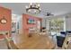 Open concept dining area with a chandelier and view of the living room at 5801 Oyster Catcher Dr. # 1923, North Myrtle Beach, SC 29582