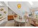 Dining area with a glass-top table and wicker chairs near kitchen at 215 Double Eagle Dr. # G-2, Myrtle Beach, SC 29575
