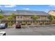 Brick building with parking lot and palm trees at 215 Double Eagle Dr. # G-2, Myrtle Beach, SC 29575