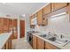 Condo kitchen with wood cabinets and appliances at 215 Double Eagle Dr. # G-2, Myrtle Beach, SC 29575