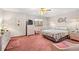 Spacious bedroom with a ceiling fan, carpeting, and ample closet space at 215 Double Eagle Dr. # G-2, Myrtle Beach, SC 29575