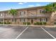 Brick building with parking lot and palm trees at 215 Double Eagle Dr. # G-2, Myrtle Beach, SC 29575
