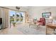 Living room with water views, neutral decor and wicker furniture at 215 Double Eagle Dr. # G-2, Myrtle Beach, SC 29575