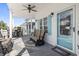 Inviting front porch with seating and ceiling fan at 6001 S Kings Hwy., Myrtle Beach, SC 29575