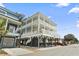 Two-story home with wrap-around porch at 6001 S Kings Hwy., Myrtle Beach, SC 29575