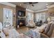 Cozy living room with stone fireplace and comfortable seating at 6001 S Kings Hwy., Myrtle Beach, SC 29575
