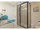 Bathroom with a walk-in shower, granite countertop, and neutral tile at 6001 S Kings Hwy., Myrtle Beach, SC 29575