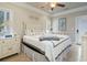 Bright bedroom with a queen bed and beachy decor, featuring access to a private balcony at 6001 S Kings Hwy., Myrtle Beach, SC 29575