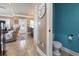 Small powder room with teal walls and a pedestal sink at 6001 S Kings Hwy., Myrtle Beach, SC 29575