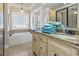 Elegant bathroom with a double vanity, soaking tub, and walk-in shower at 6001 S Kings Hwy., Myrtle Beach, SC 29575