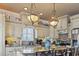 Elegant kitchen boasts granite island, custom cabinets, and pendant lighting at 6001 S Kings Hwy., Myrtle Beach, SC 29575