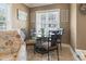 Charming breakfast nook with glass-top table and four chairs at 6001 S Kings Hwy., Myrtle Beach, SC 29575