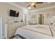 Spacious bedroom with a dresser, TV, and ensuite bathroom access at 6001 S Kings Hwy., Myrtle Beach, SC 29575
