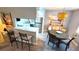 Dining room with round table and chairs, adjacent to kitchen at 10166 Beach Dr. # 5306, Calabash, NC 28467