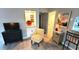 Living room with yellow chair and built in shelving at 10166 Beach Dr. # 5306, Calabash, NC 28467