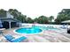 Community pool with plenty of lounge chairs for relaxing at 10166 Beach Dr. # 5306, Calabash, NC 28467