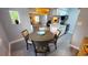 Dining room with round table and chairs, near kitchen and living room at 10166 Beach Dr. # 5306, Calabash, NC 28467