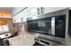 Modern kitchen with stainless steel appliances and granite countertops at 10166 Beach Dr. # 5306, Calabash, NC 28467