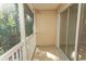 Screened balcony with tiled flooring, white railing, and wooded views at 3681 Claypond Rd. # 3107, Myrtle Beach, SC 29579