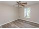 Well-lit bedroom with wood-look floors and a window at 3681 Claypond Rd. # 3107, Myrtle Beach, SC 29579