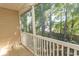 Enjoy serene wooded views from this screened balcony at 3681 Claypond Rd. # 3107, Myrtle Beach, SC 29579