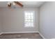 Bright bedroom with ceiling fan and window view at 3681 Claypond Rd. # 3107, Myrtle Beach, SC 29579