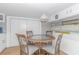 Cozy dining area with a round table and four chairs at 6001-1424 S Kings Hwy., Myrtle Beach, SC 29575