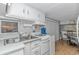 Efficient kitchen with white cabinets and stainless steel appliances at 6001-1424 S Kings Hwy., Myrtle Beach, SC 29575