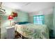 Bright bedroom with a double bed, nightstand, and window at 6001 - 5238 S Kings Hwy., Myrtle Beach, SC 29575