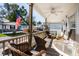 Front porch with seating and ceiling fan at 6001 - 5238 S Kings Hwy., Myrtle Beach, SC 29575