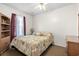 Comfortable bedroom with a double bed, wooden bookcase, and window at 6001 - 5238 S Kings Hwy., Myrtle Beach, SC 29575